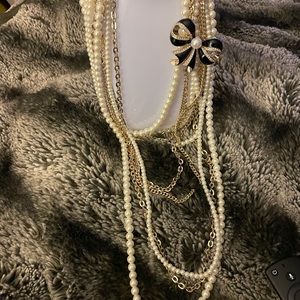 Pearl necklace multi strand with gold chains &removable black broach ribbon
